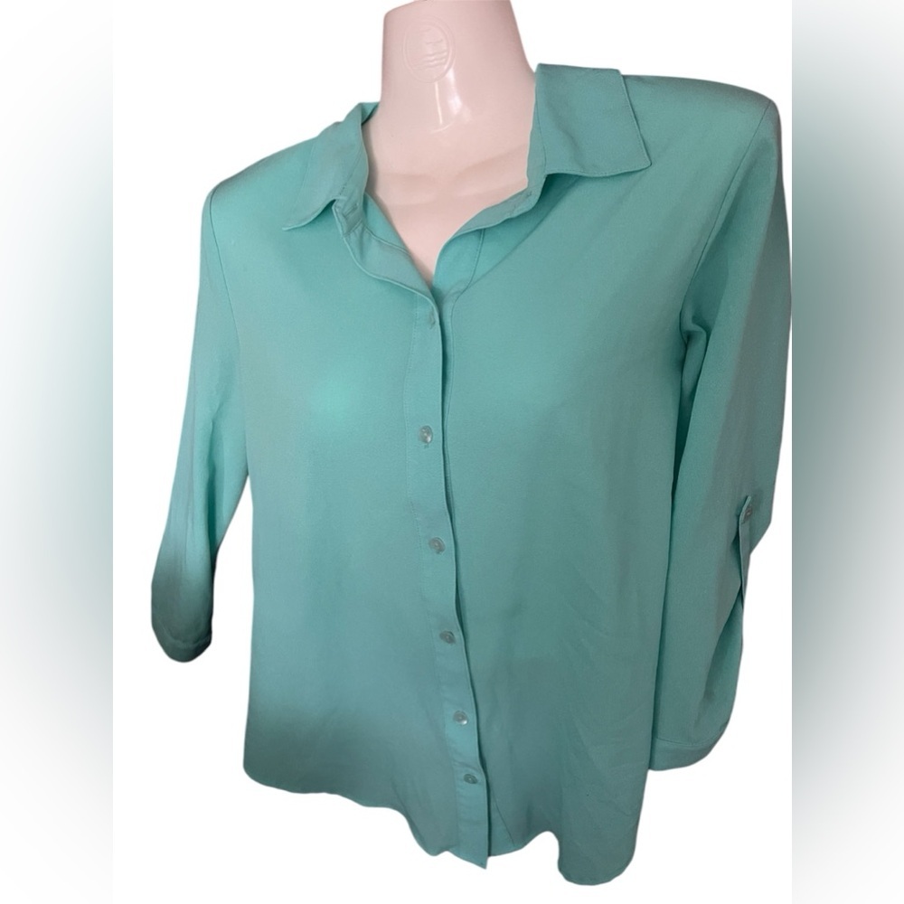 BCX size small blouse with cut out back and colorful design on back